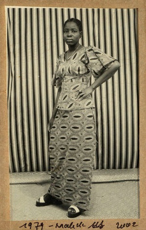 Untitled [Portrait of a Woman Standing Before a Striped Background]