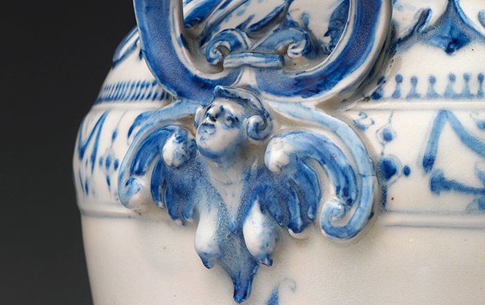 Detail of a blue and white handle from an Italian ewer made of porcelain