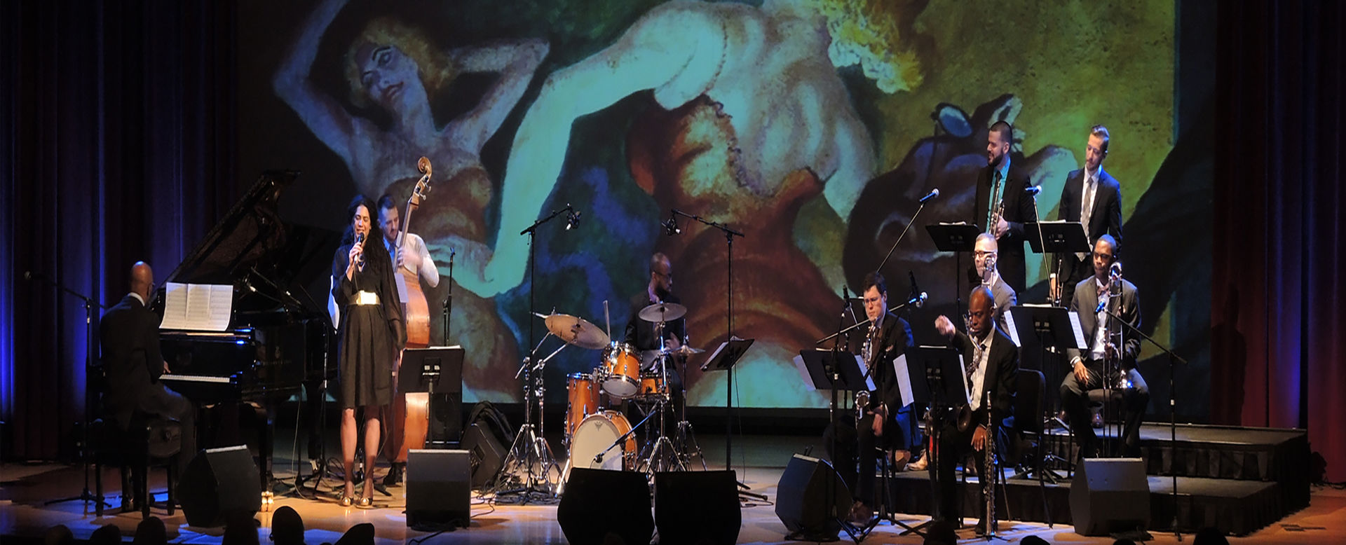 Woman singing with band at the Grace Rainey Rogers auditorium 