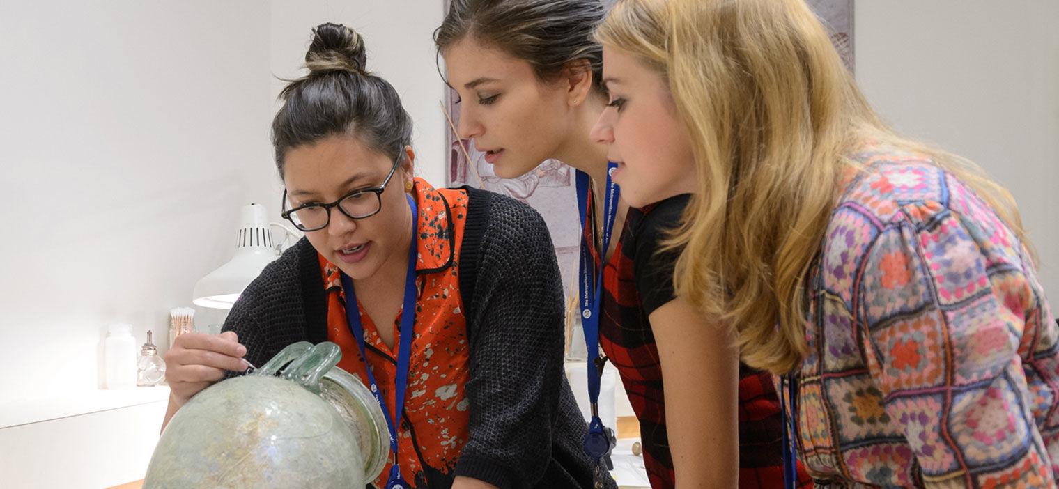 Fellows observing art