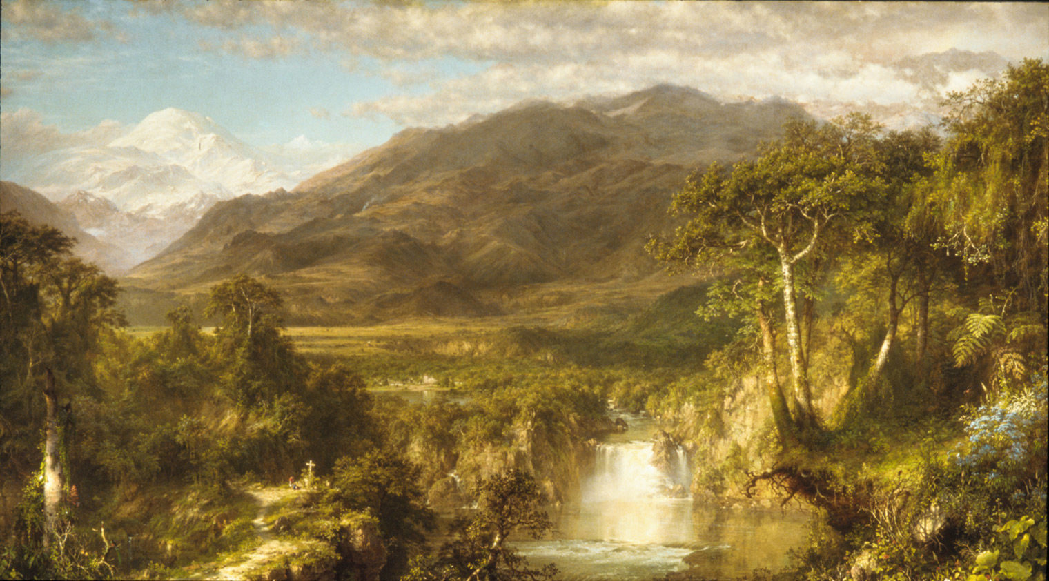 A landscape with a large snow-covered mountain in the distant background, large rocky mountains in the near background, open plains in the middle ground and a lush forest with a raging river and waterfall in the foreground