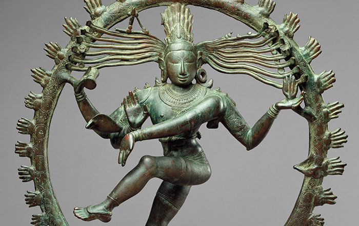 art assignment class 6 An oxidized copper sculpture of an Indian deity with four arms, standing on one leg dancing, encircled by a ring of stylized fire