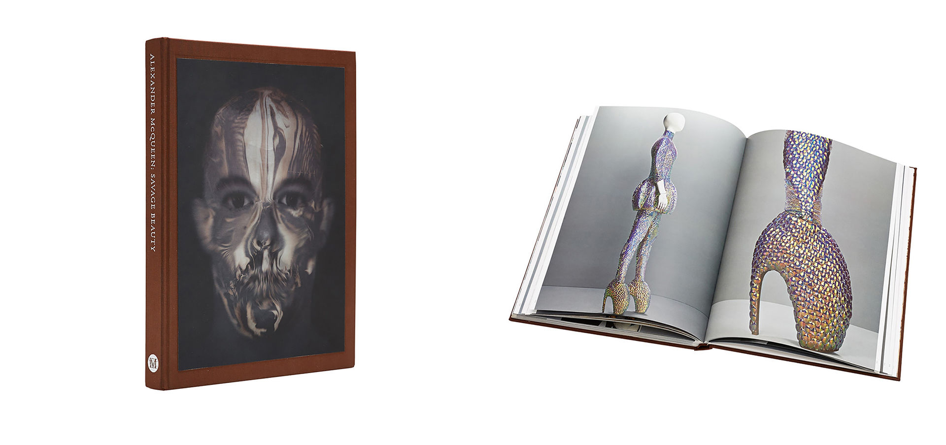 A picture of a book depicting fashion designed by Alexander McQueen