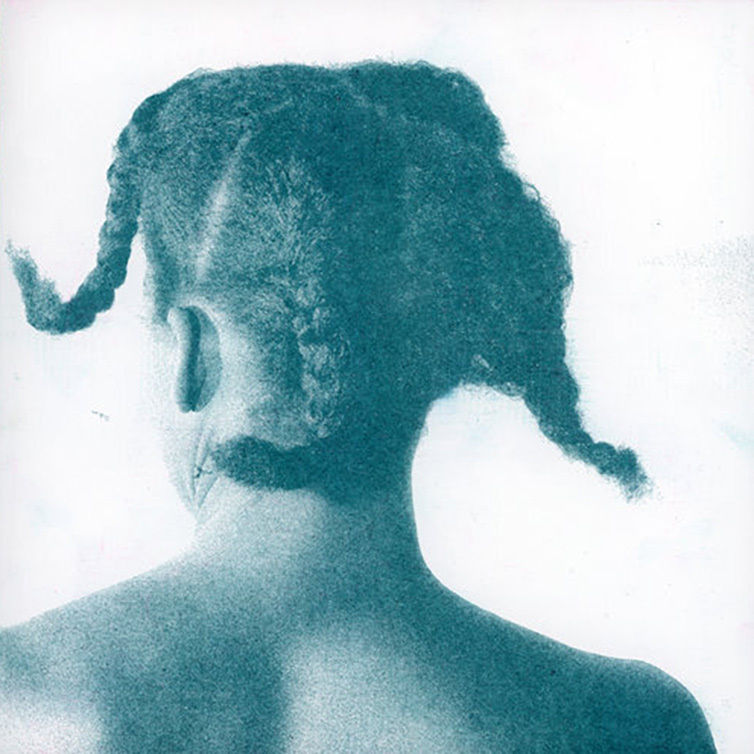 A color-tinted photograph of the back of a woman's head