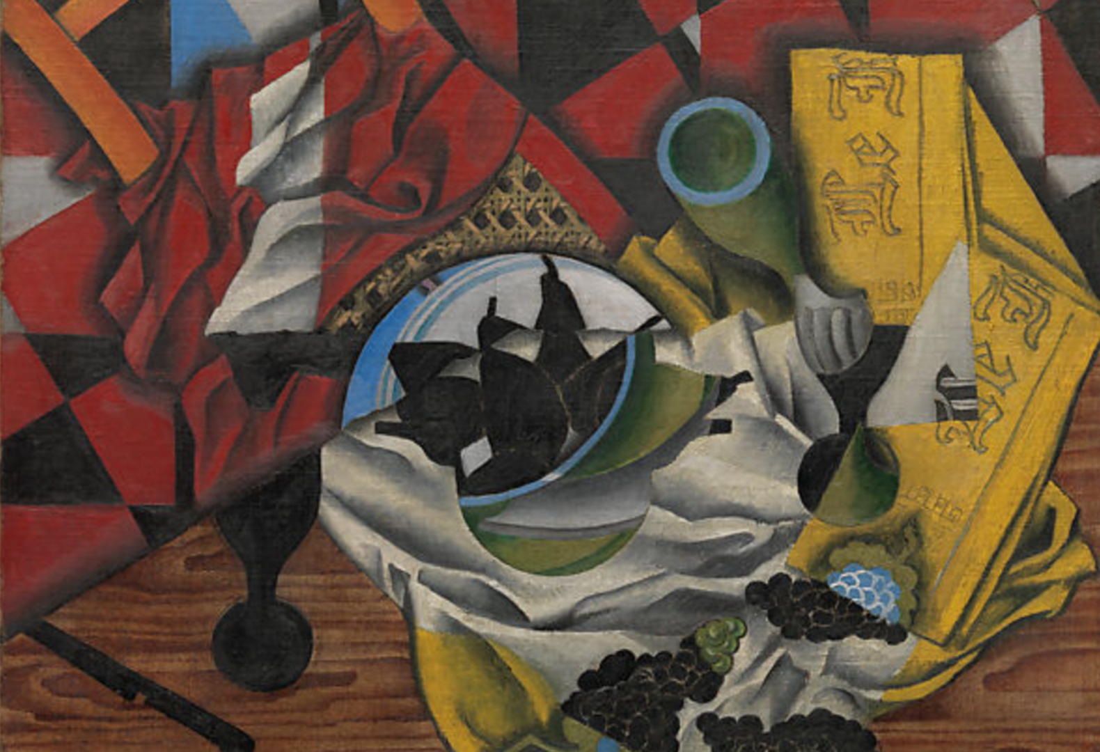Red and yellow oil painting of a table hastily left with pears, grapes, a knife and crumpled napkin on it called 
