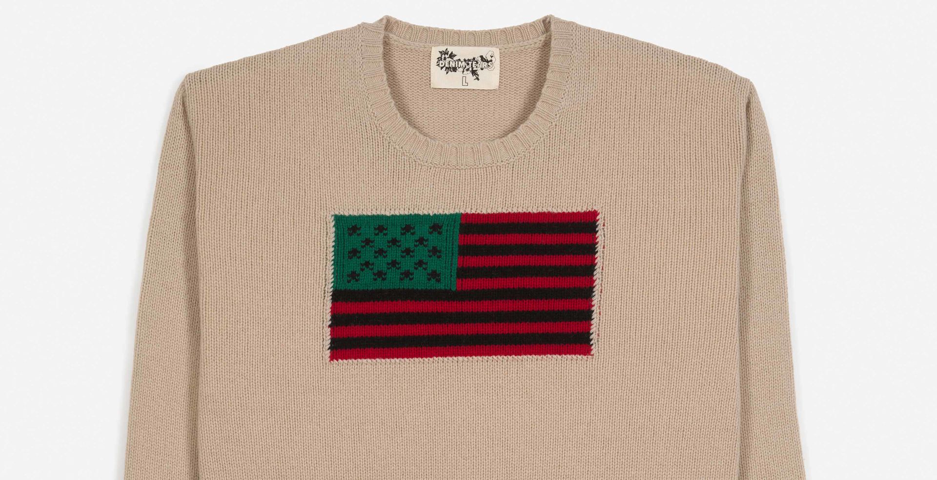 “Tyson Beckford” beige crewneck sweater with the Pan African flag