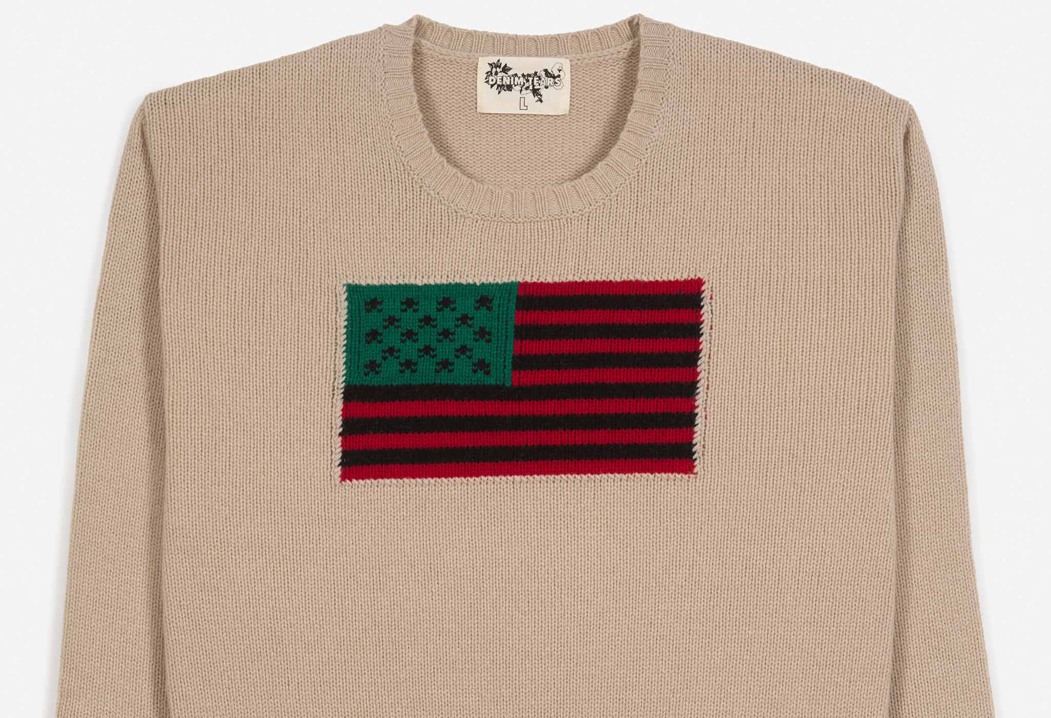 “Tyson Beckford” beige crewneck sweater with the Pan African flag