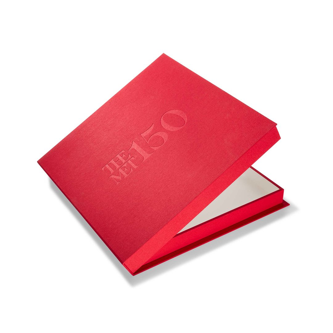 The Met 150th Print Portfolio box, in bright red