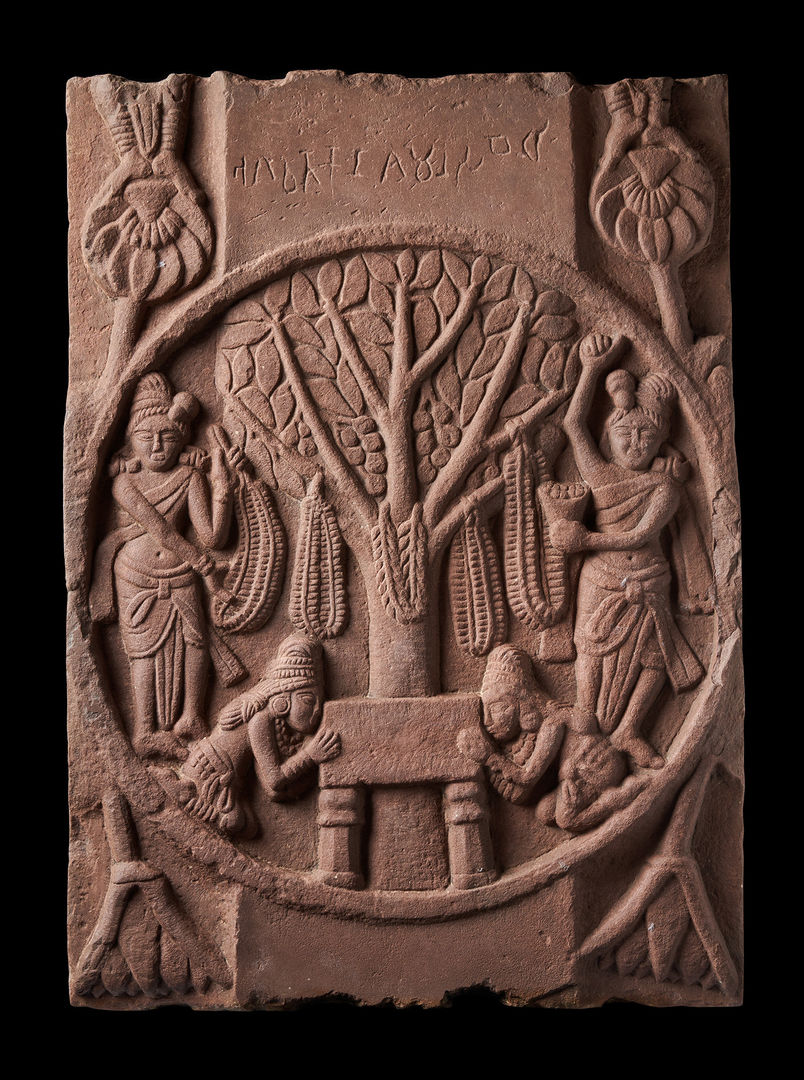 Sandstone medallion carving depicting a tree with four human figures around it