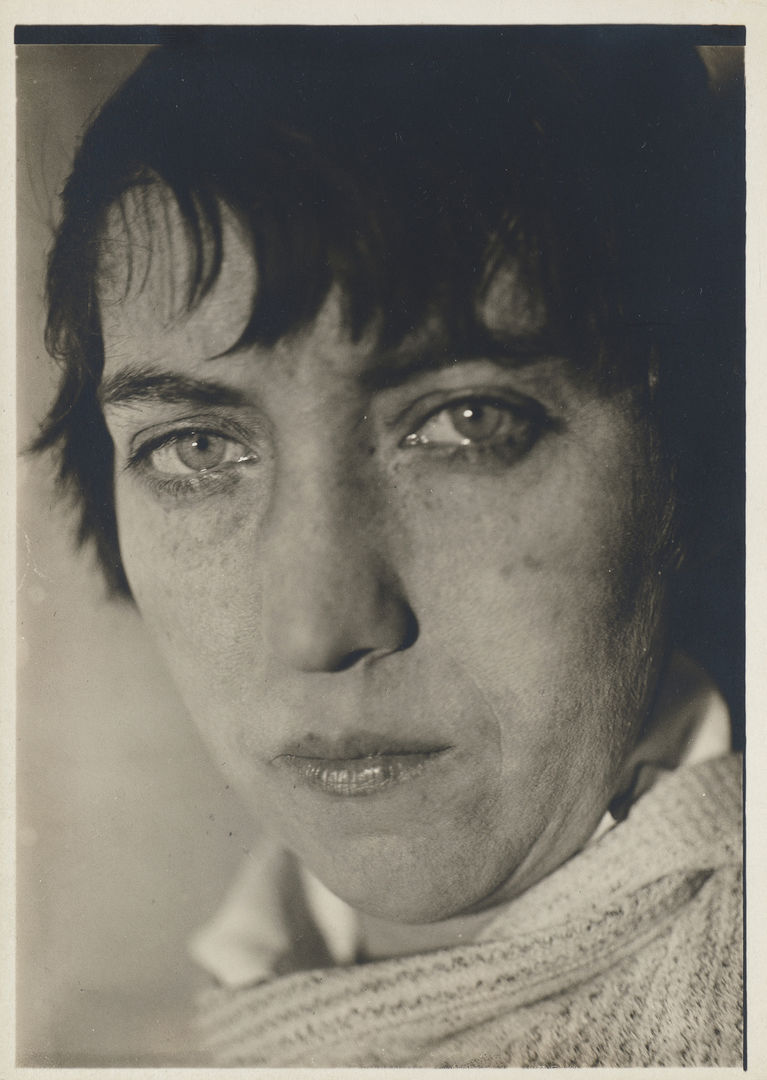 Close up portrait of the artist Berenice Abbot in black and white. 