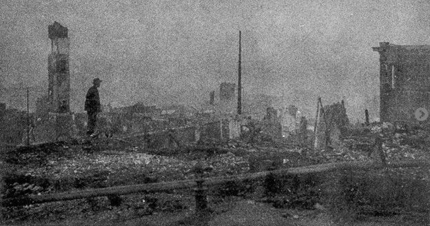 Black and white photo of the rubble of Chinatown post-disaster