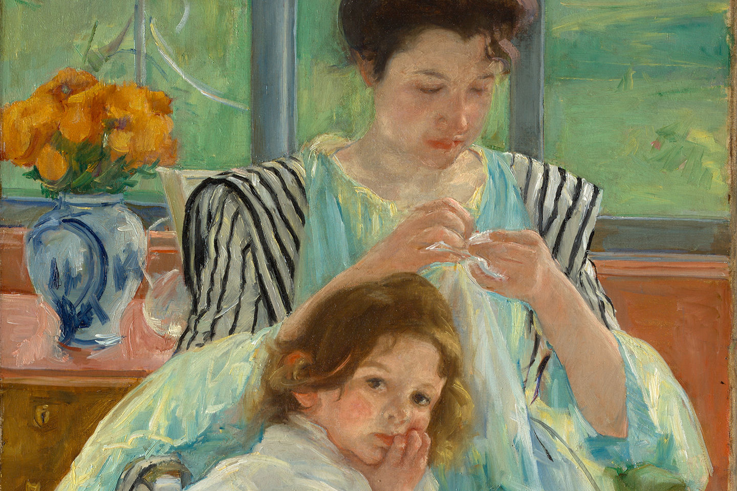 Detail of Mary Cassatt’s painting of a young mother sewing with a child resting on her lap; the room has a vase of vibrant flowers and a bay of windows overlooking a green wooded area.