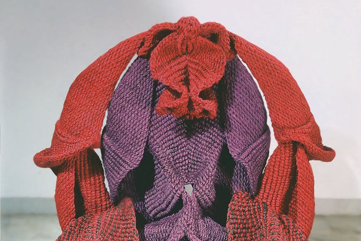 Detail of Mrinalini Mukherjee’s fibre red and purple sculpture depicting  unfurling forms that resemble female genitalia.