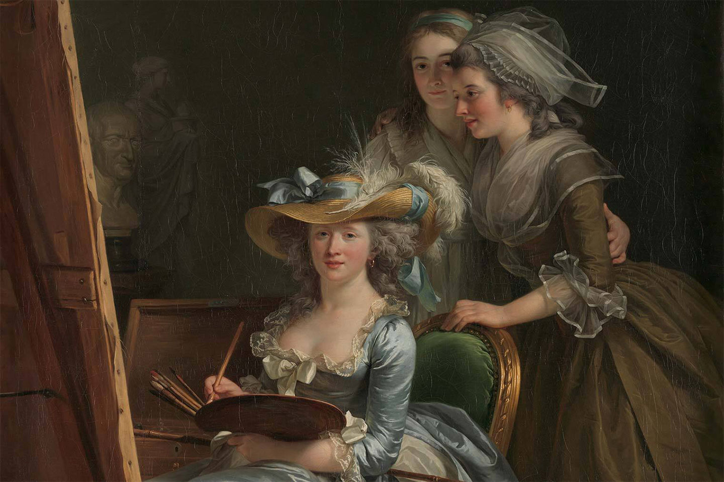 A painting of three women in an 18th-century painting studio