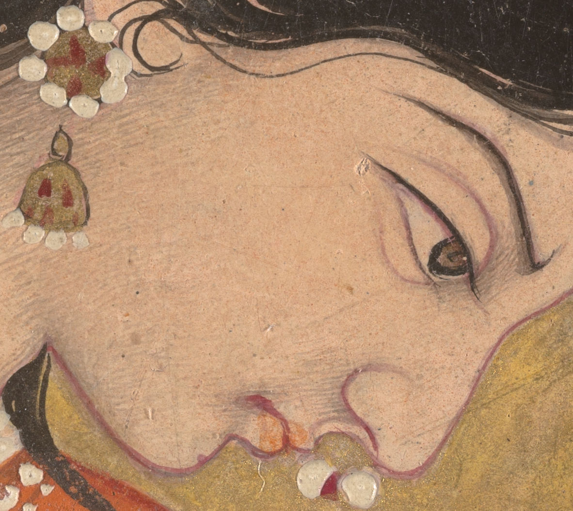 Close up of a painting of a woman's face in side profile