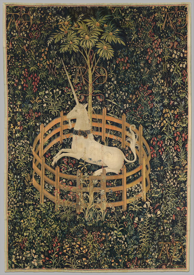 Woven tapestry of a unicorn in a garden surrounded by a fence