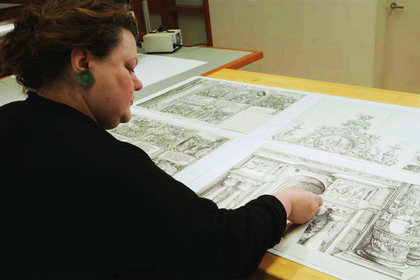 Paper Conservator Rachel Mustalish working on Albrecht Dürer's Monumental Arch of Honor