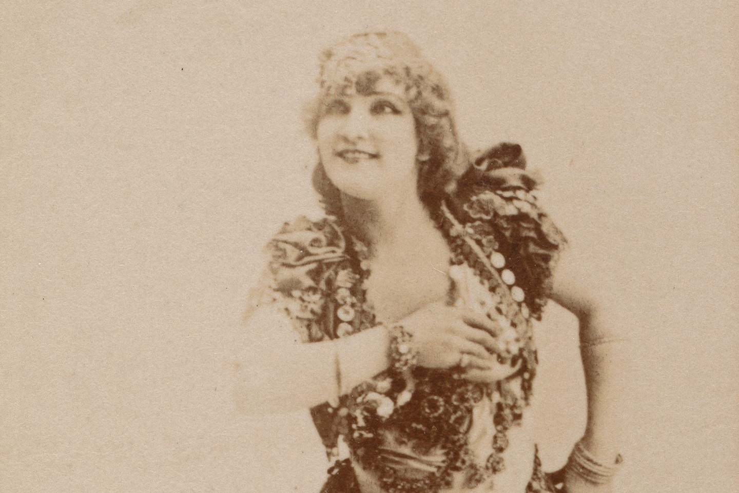Detail of a cigarette card featuring belly dancer Omene in 