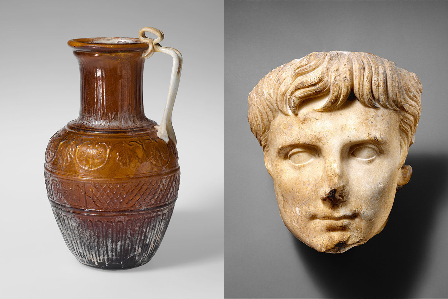 A brown glass jug and marble portrait of Emperor Augustus from ancient Rome