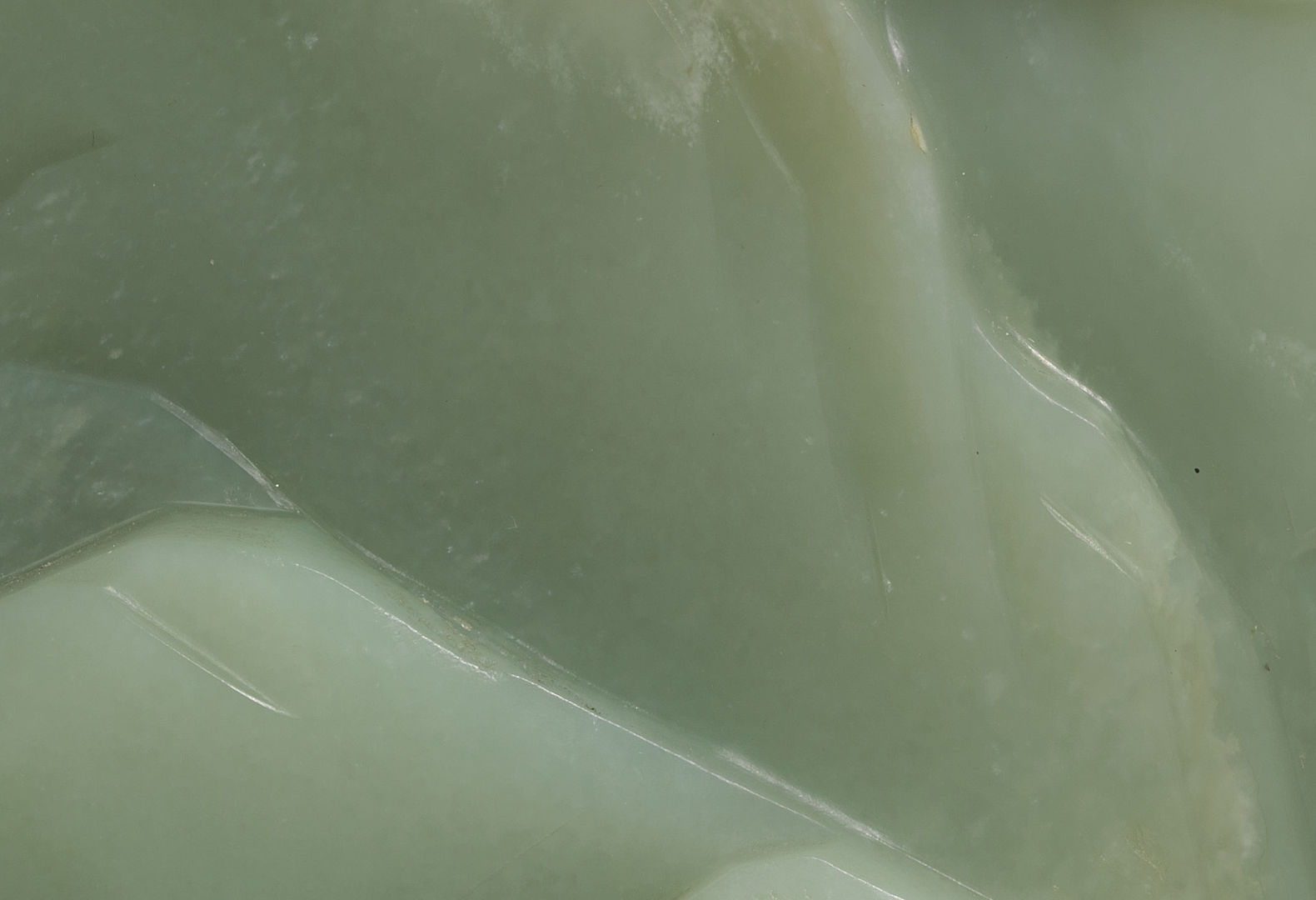 Extreme close-up of a carved piece of green jade