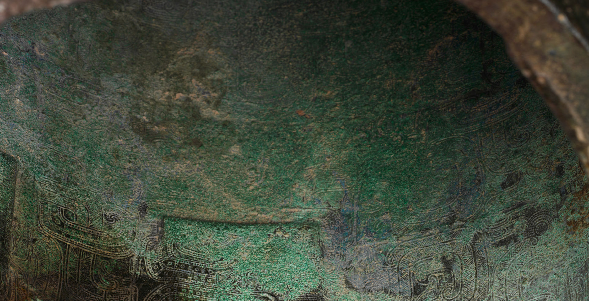 Detail of the interior of a 5th-century BC bronze Chinese zhong or bell with a green patina