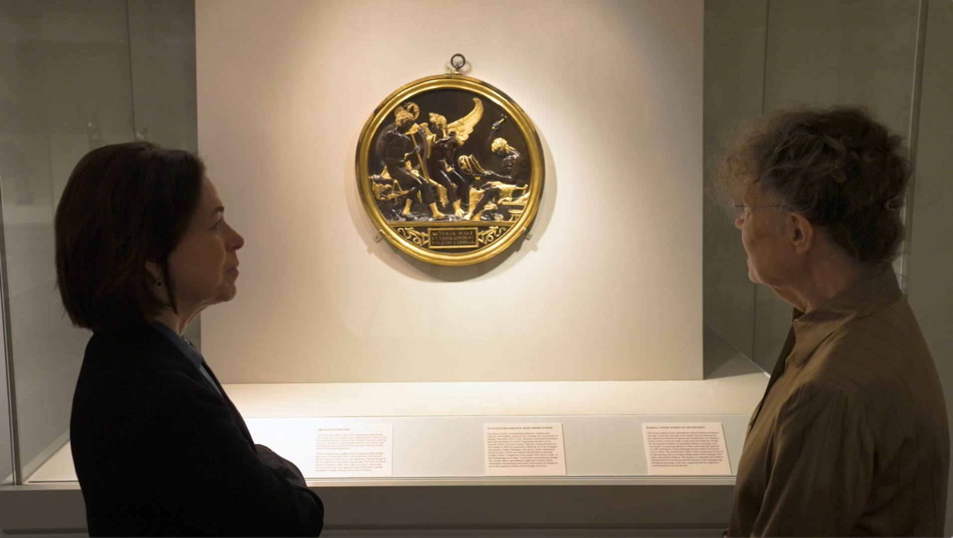 Two curators behold the Mantuan Roundel, installed in the galleries