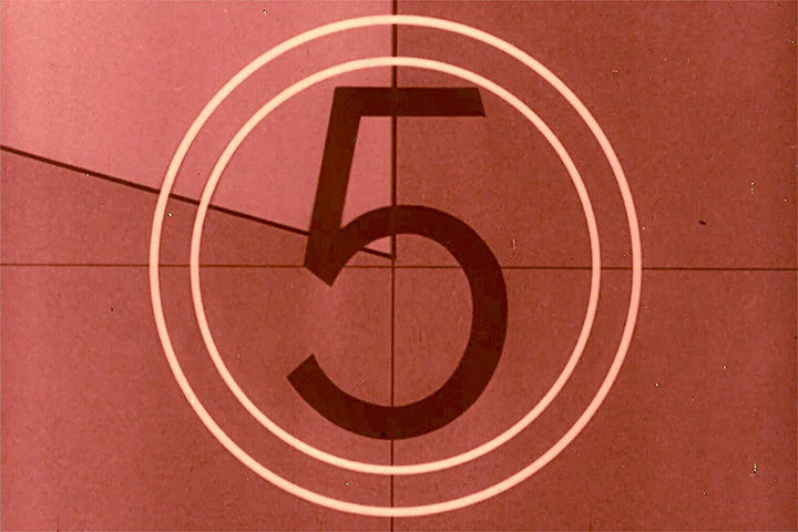A red, old movie-style countdown clock starting at the number 5.