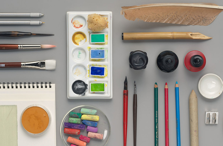 Bird's-eye-view of various drawing materials on a table