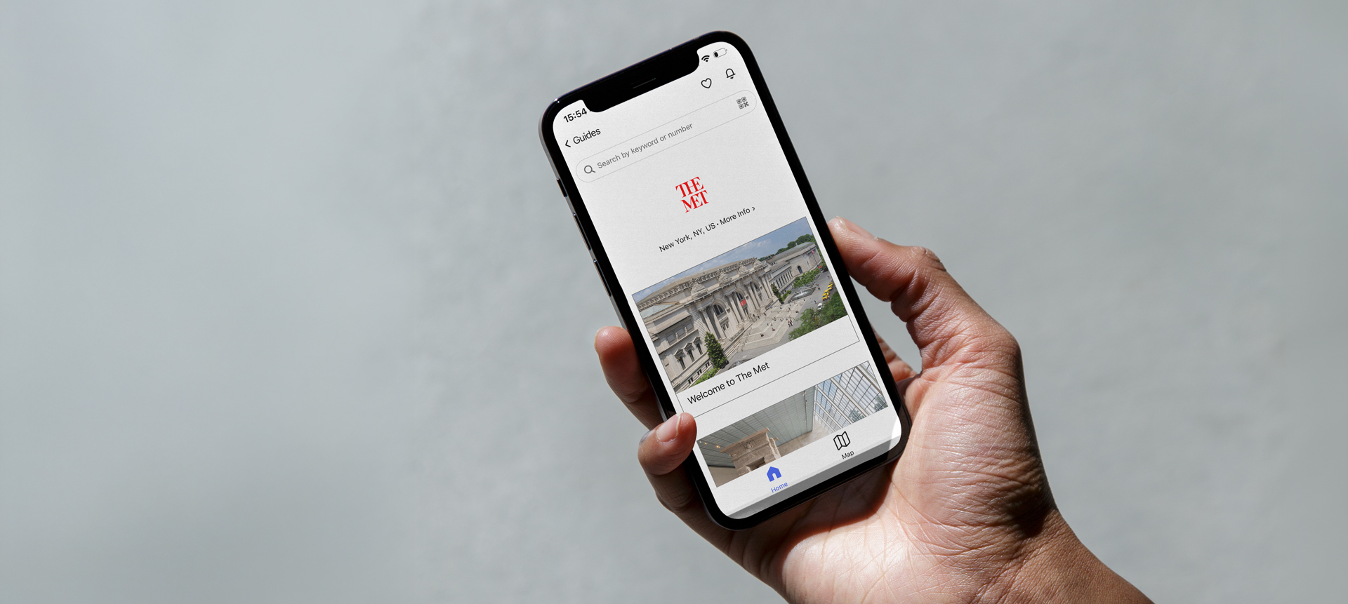 An iPhone with screen showing The Met Fifth Avenue guide on the Bloomberg Connects app.
