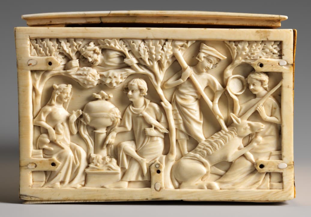 An ivory relief sculpture of medieval courtly figures