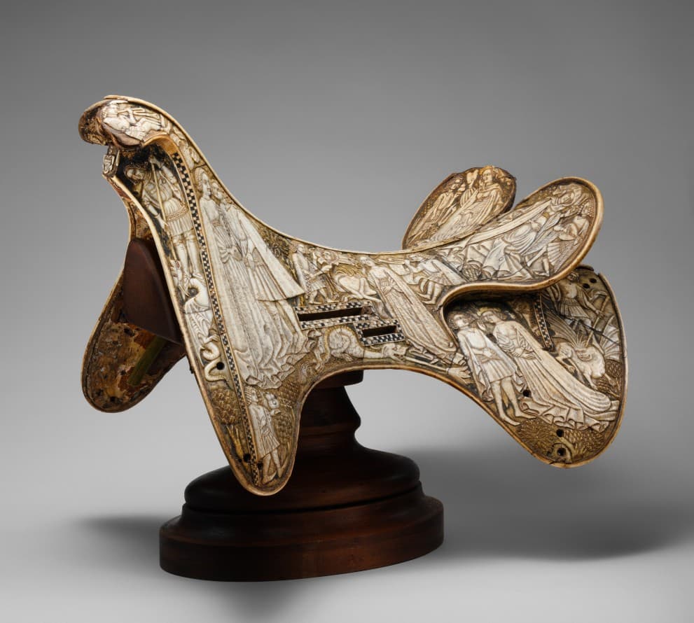 A carved horse saddle made from bovine bone