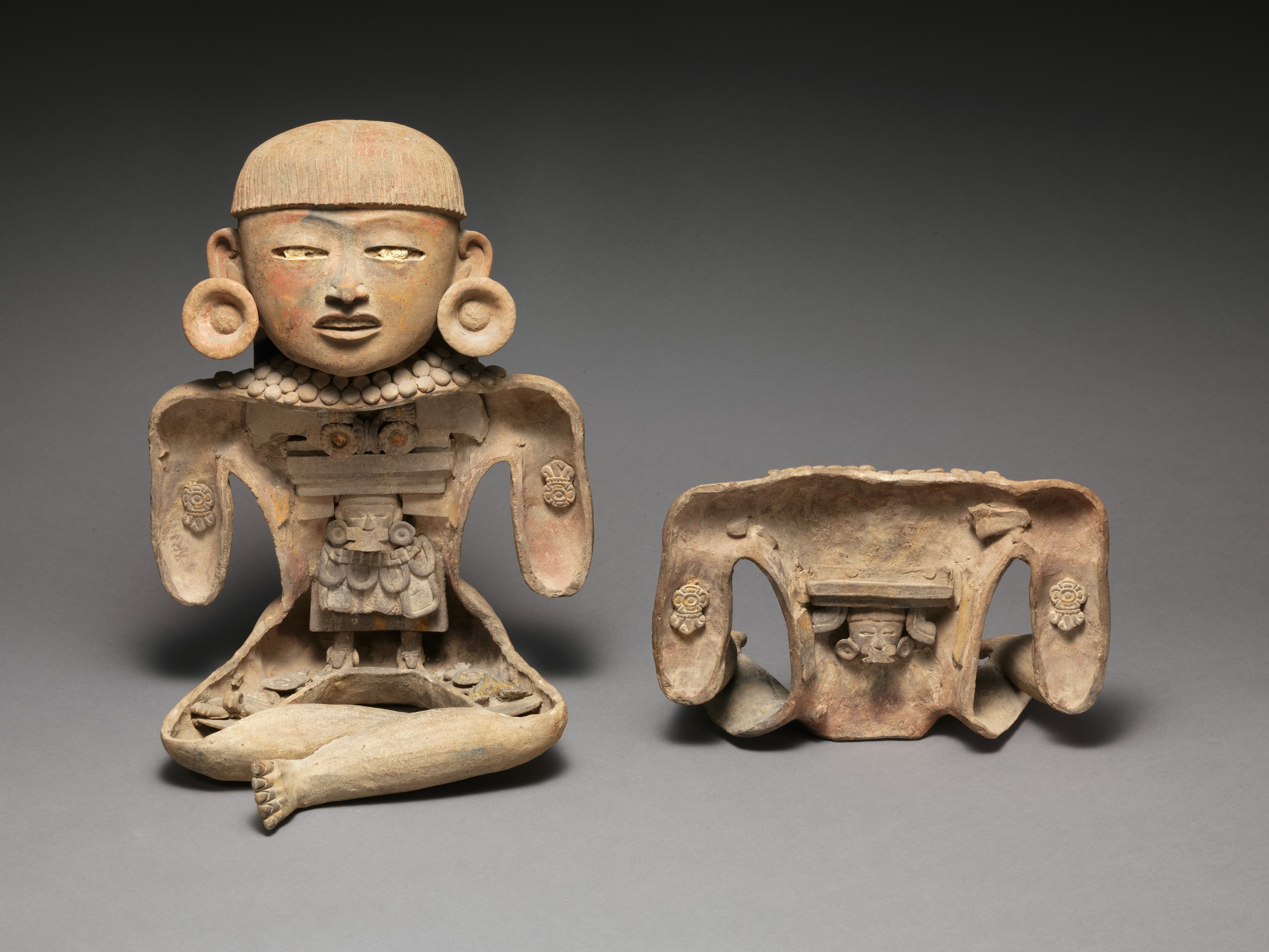  Teotihuacan or Maya artist(s), Host figure. Ceramic, pyrite, pigment, H. 14 3/4 × W. 10 3/4 × D. 10 1/4 in. (37.5 × 27.3 × 26 cm). The Metropolitan Museum of Art, New York. Partial and Promised Gift of Linda M. Lindenbaum, from the Collection of Samuel H. and Linda M. Lindenbaum, 2015