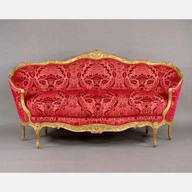 Red and gold Rococo style sofa