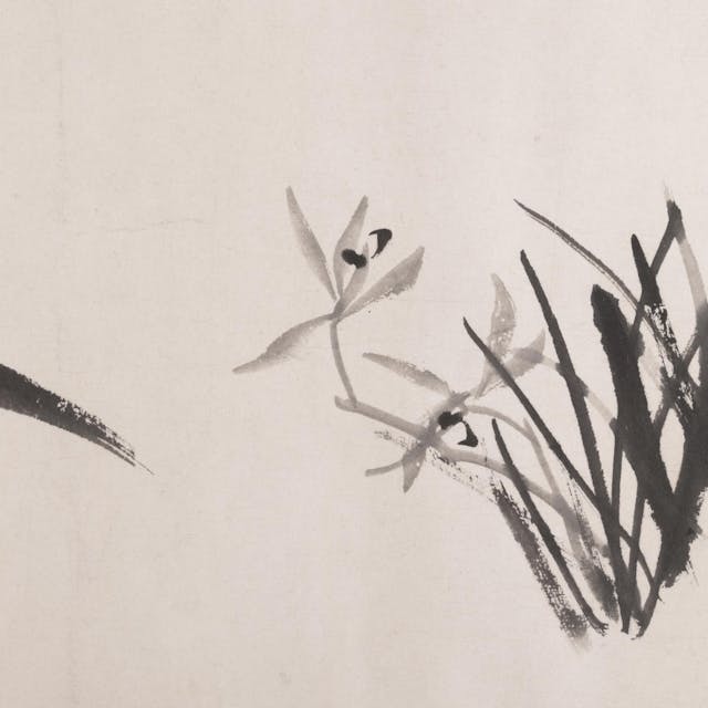 Silhouette of orchids and bamboo painted with black ink on a handscroll paper