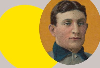 Detail of a Honus Wagner baseball card, showing his face against an orange background, with a bright yellow ovular spotlight shape behind the figure in the background
