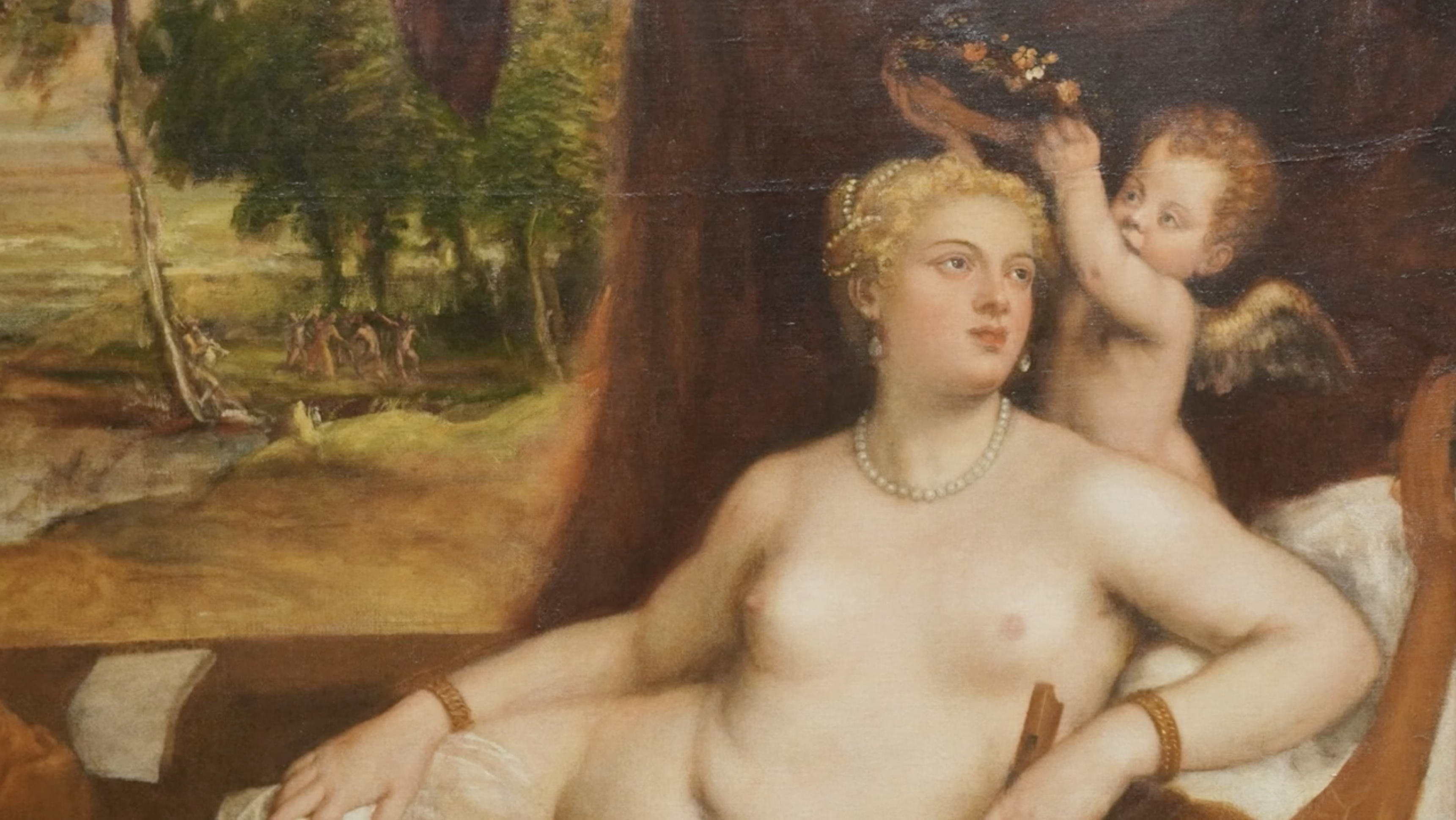European painting of white woman naked wiht a baby angel crowning her.