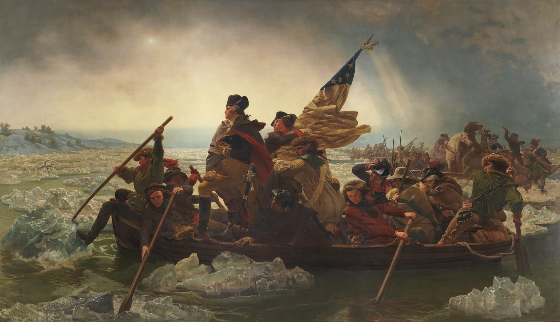 A painting depicting General George Washington leading his troops across the Delaware River during the American Revolutionary War. Washington is at the bow of a wooden boat, wrapped in a dark blue cloak, with the American flag held high. The soldiers, bundled in winter coats, row the boat through icy waters under a dim, cloudy sky.
