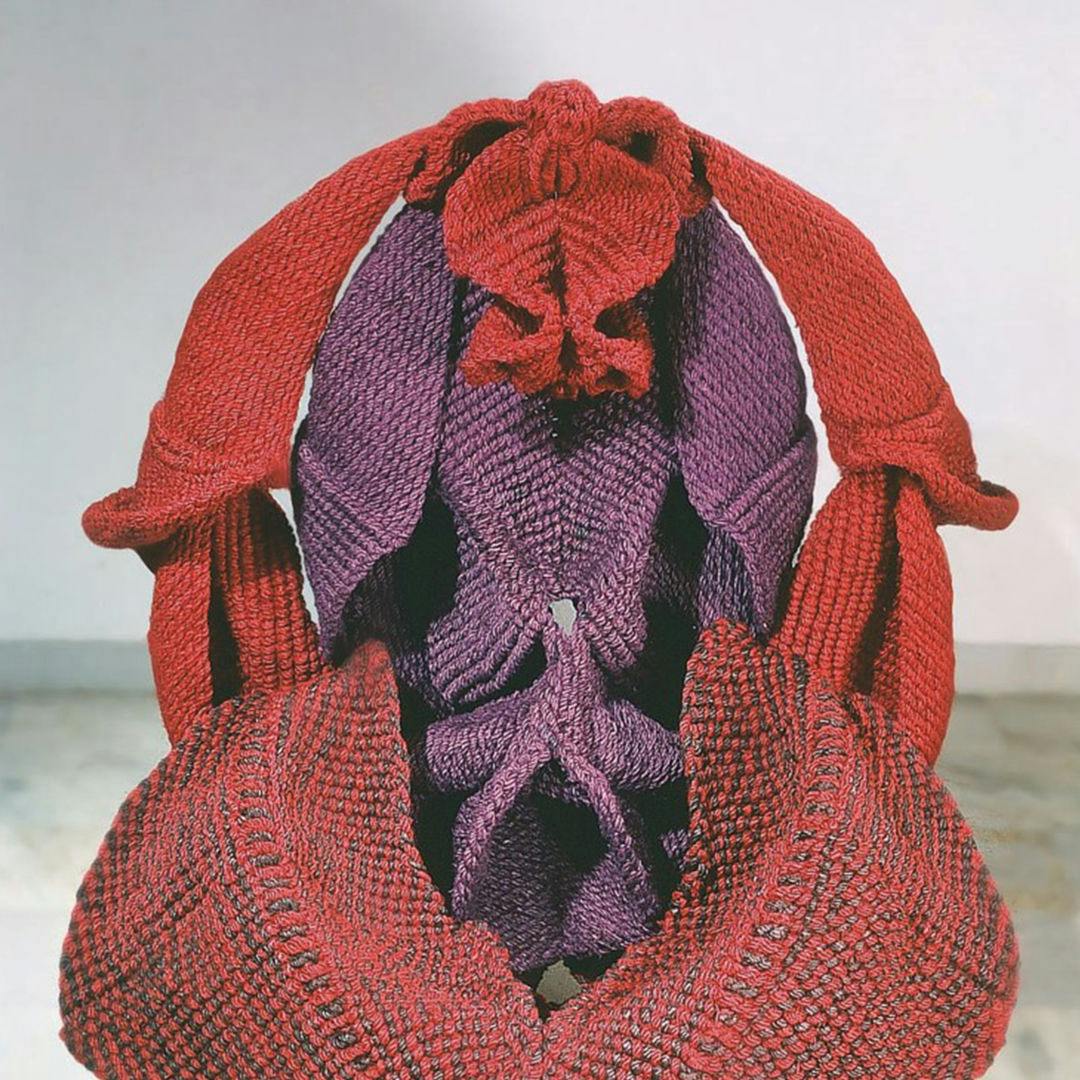 Detail of Mrinalini Mukherjee’s fibre red and purple sculpture depicting  unfurling forms that resemble female genitalia.