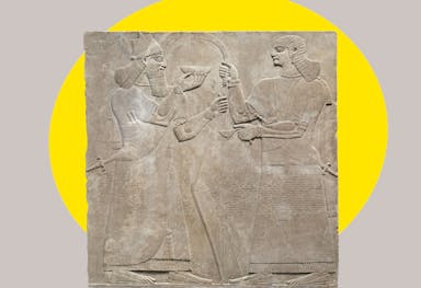 Assyrian relief with a bright yellow ovular spotlight shape behind the figure in the background
