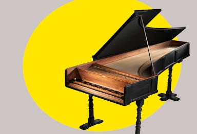 18th-century piano with a bright yellow ovular spotlight shape behind the figure in the background