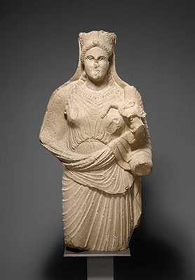 Limestone statue of Aphrodite holding winged Eros