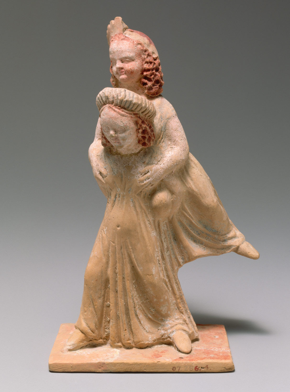 Terracotta group of two girls playing a game known as ephedrismos