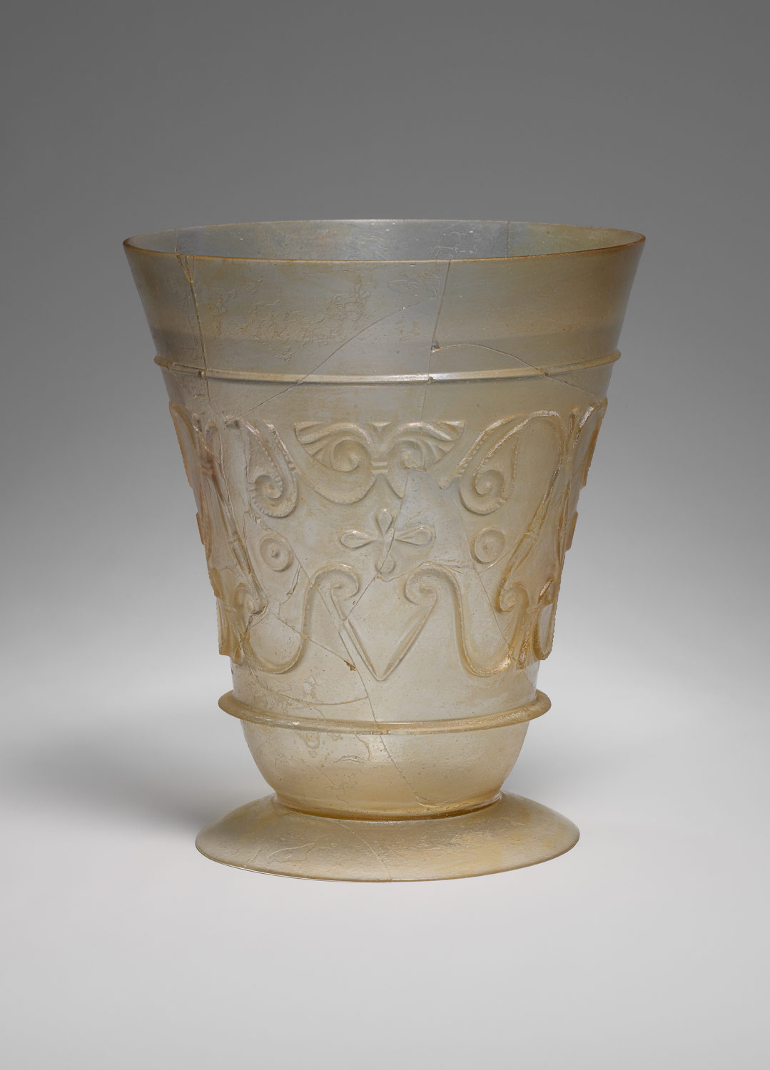 Beaker with relief-cut decoration