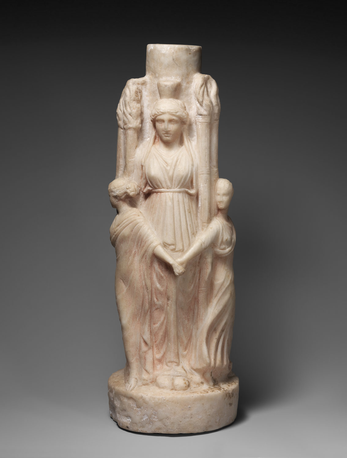 Marble statuette of triple-bodied Hekate and the three Graces