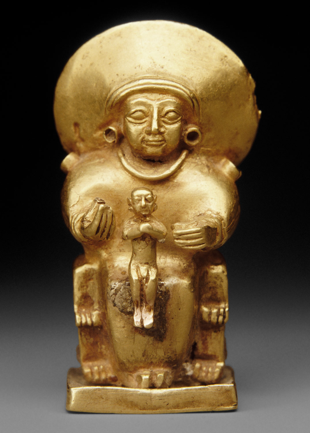 Seated goddess with a child