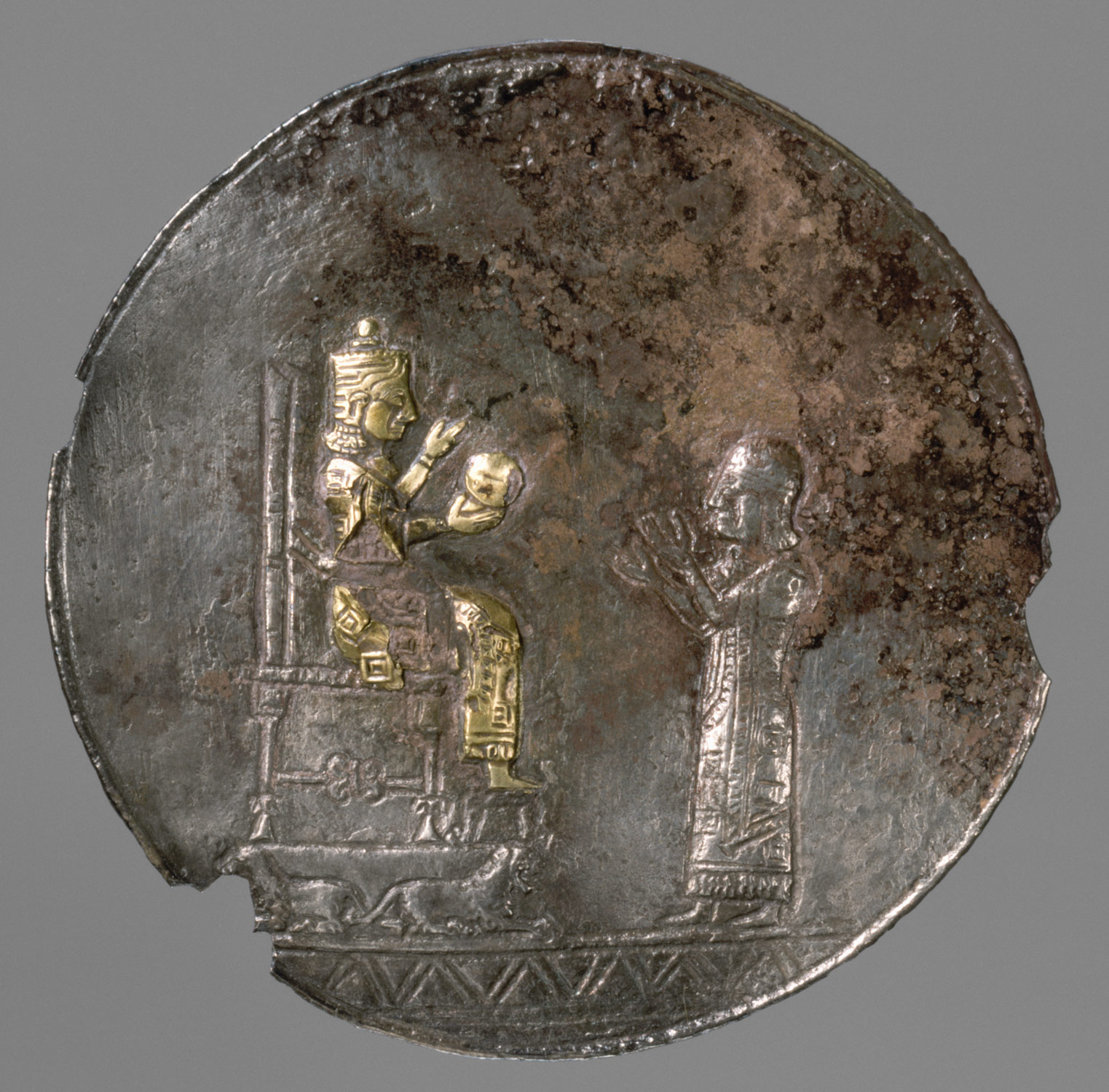 Medallion with a seated deity and a male worshipper