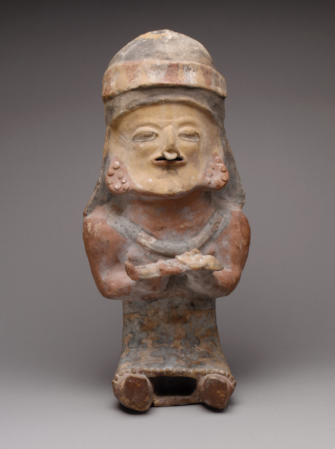 Figure Holding Child