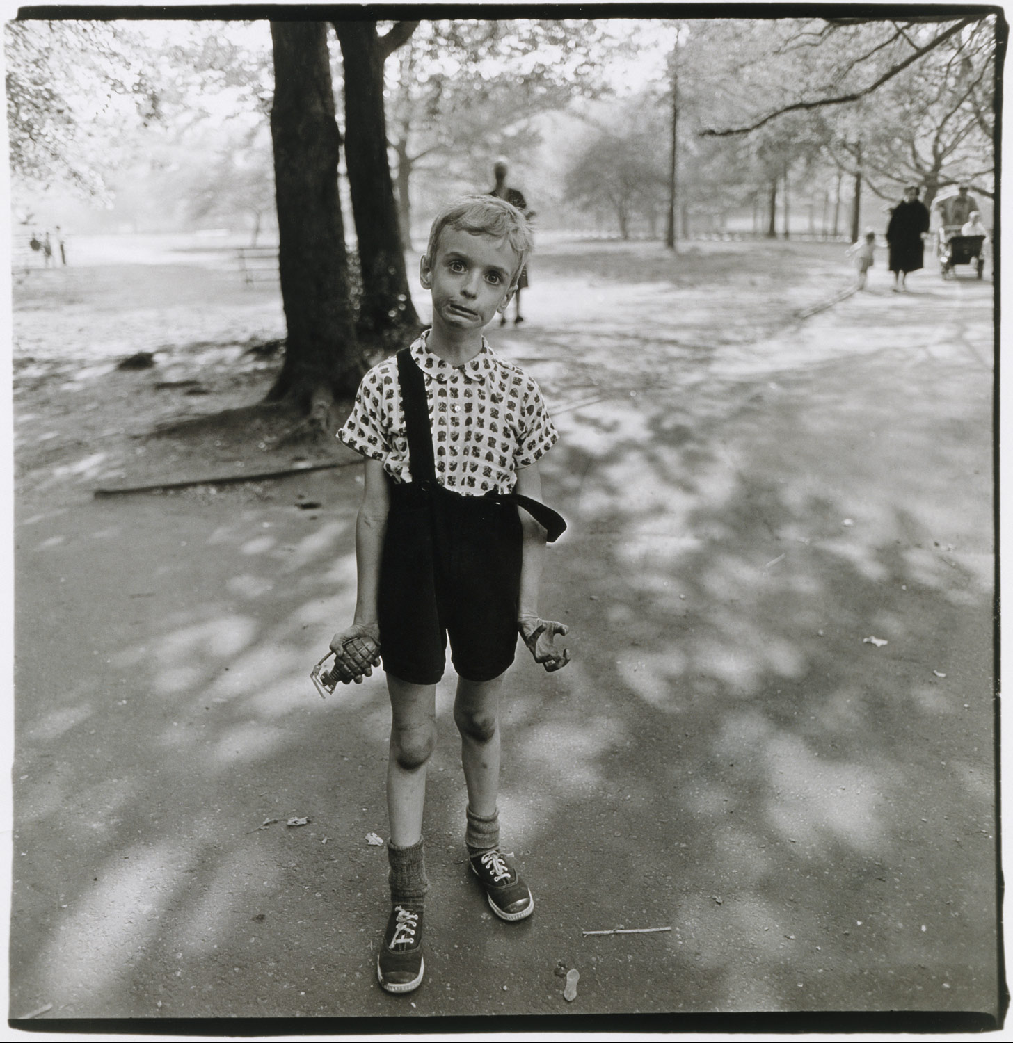 Child with a toy hand grenade in Central Park, N.Y.C.