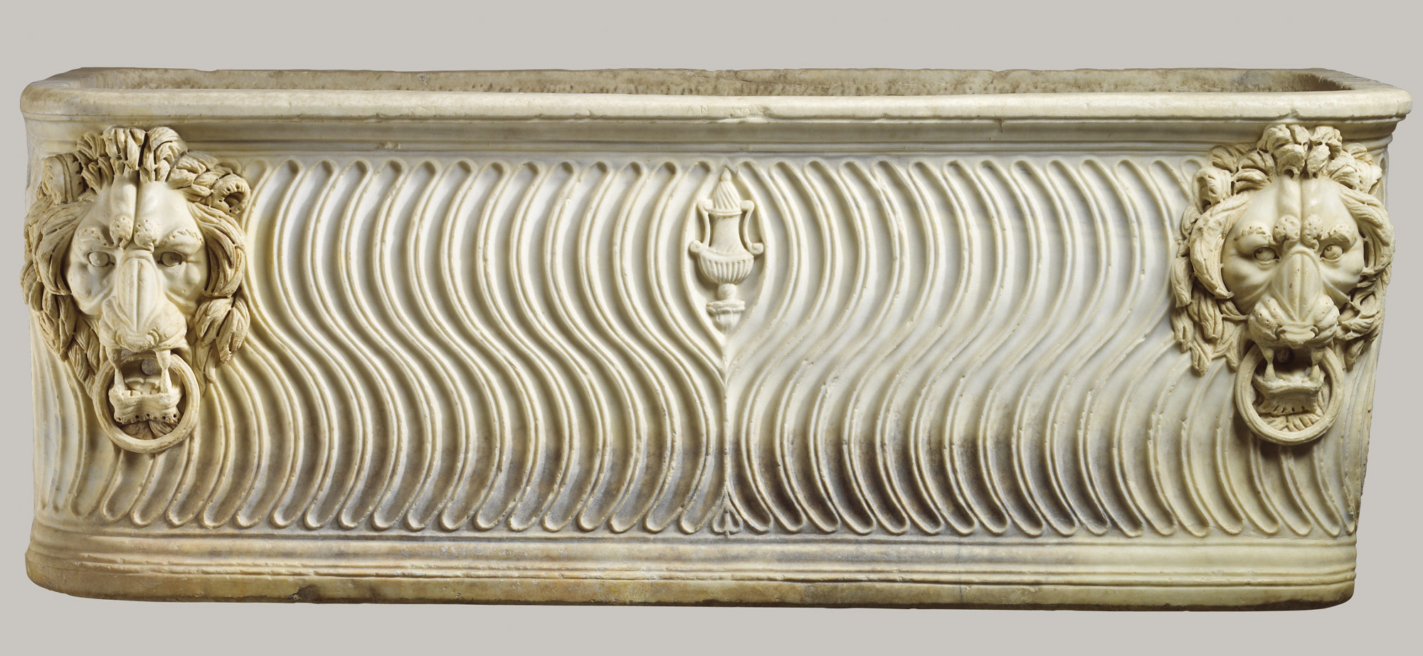 Marble strigilated sarcophagus