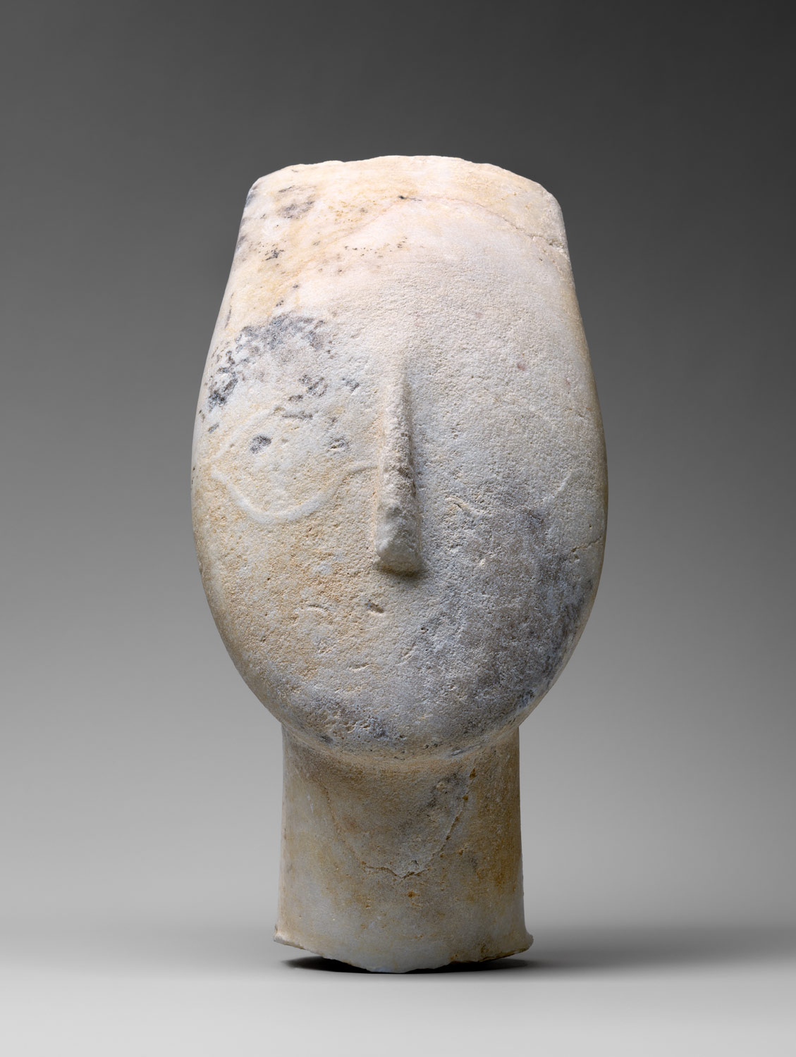 Marble head from the figure of a woman